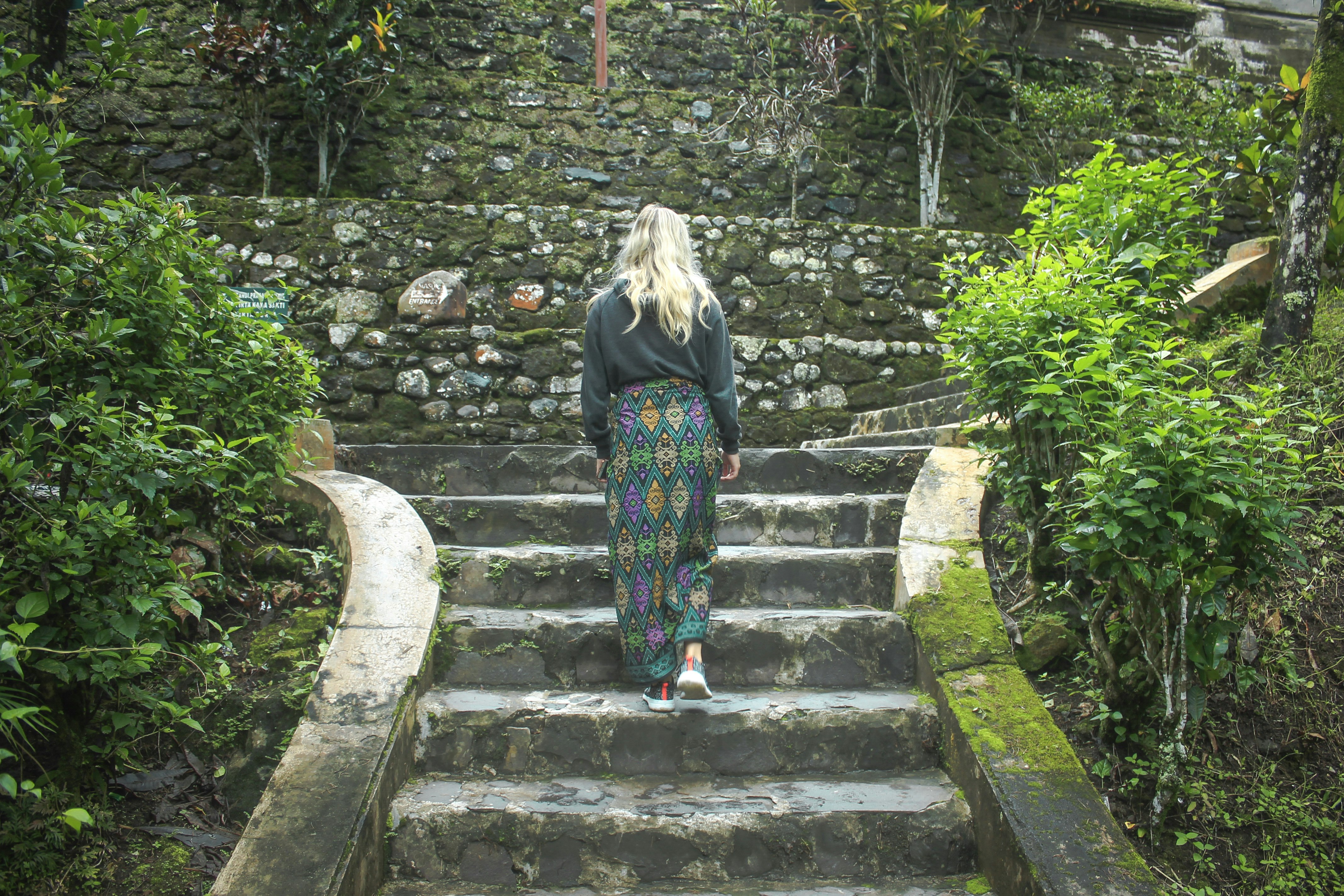 woman walking on stairs during daytime