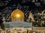 in distant photo of gold and blue temple