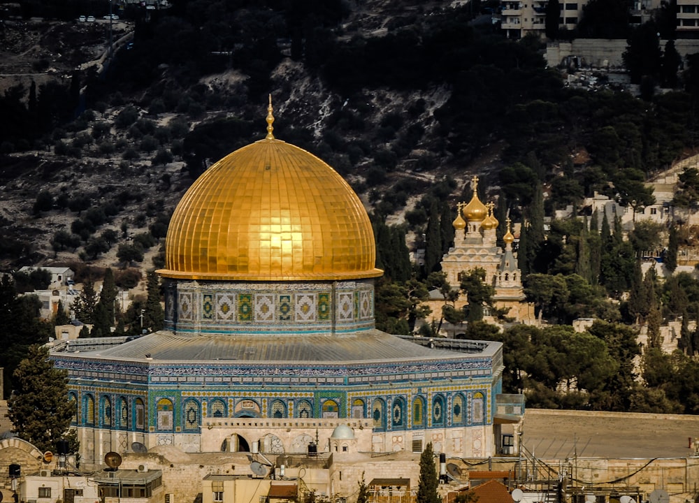 in distant photo of gold and blue temple