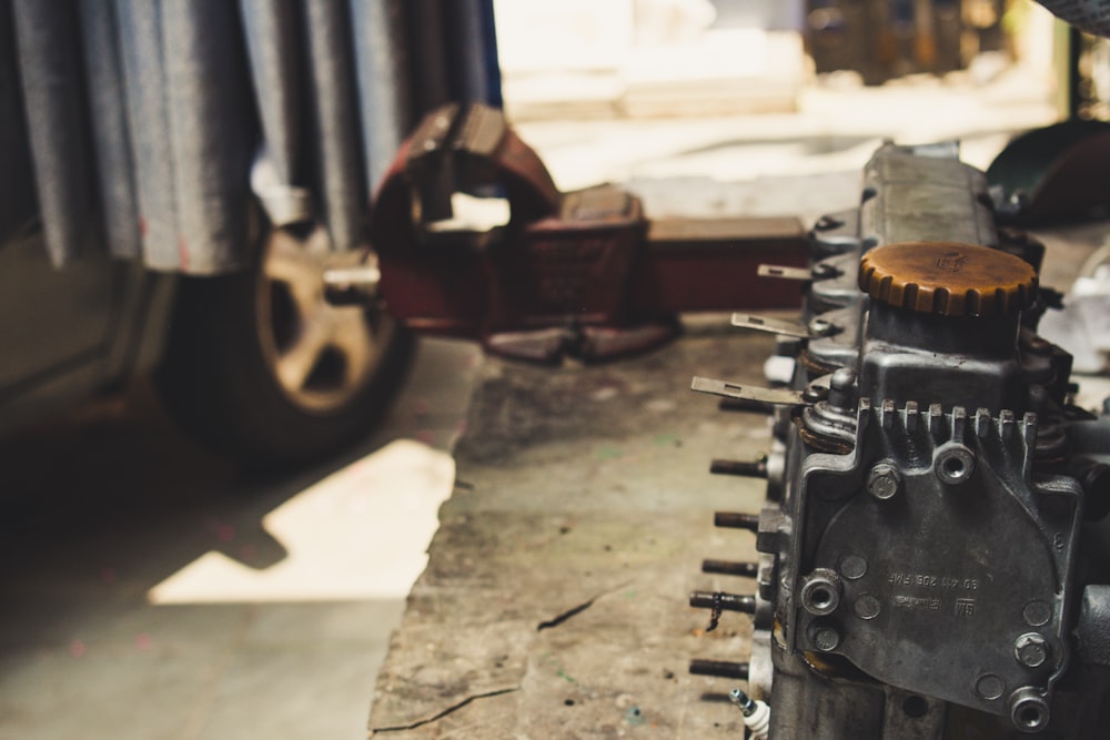 a close up of a motorcycle engine on the ground