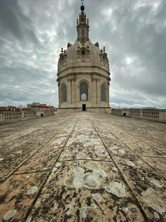 beige building during day in Basílica da Estrela Portugal