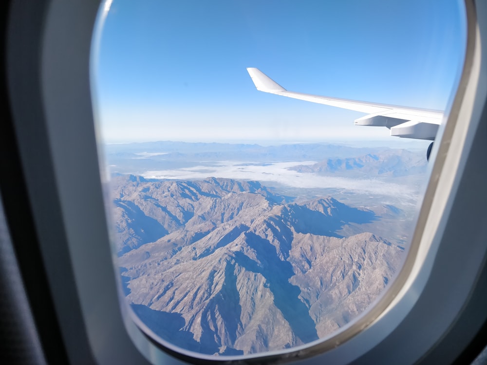 closeup photo of airplane wing during daytime