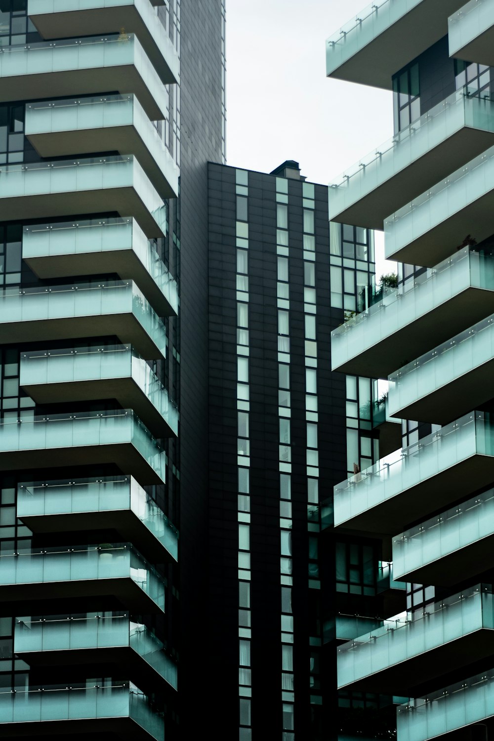 a tall building with balconies in front of it