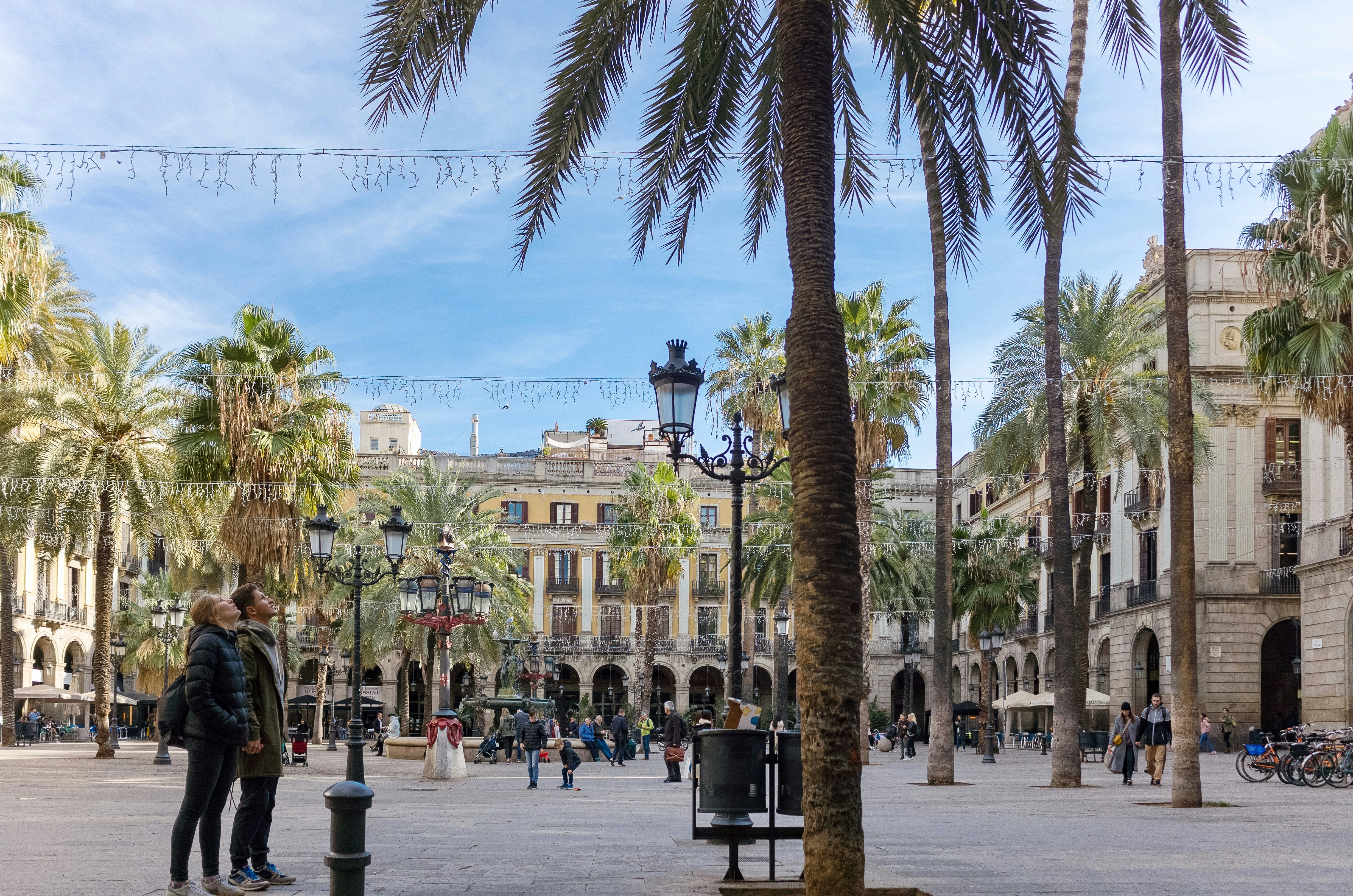 people near white building during daytime