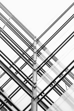 Abstract architectural lines converging to symbolize structured governance and strategic clarity.