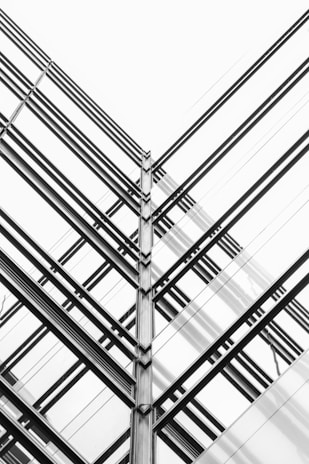 Abstract architectural lines converging to symbolize structured governance and strategic clarity.