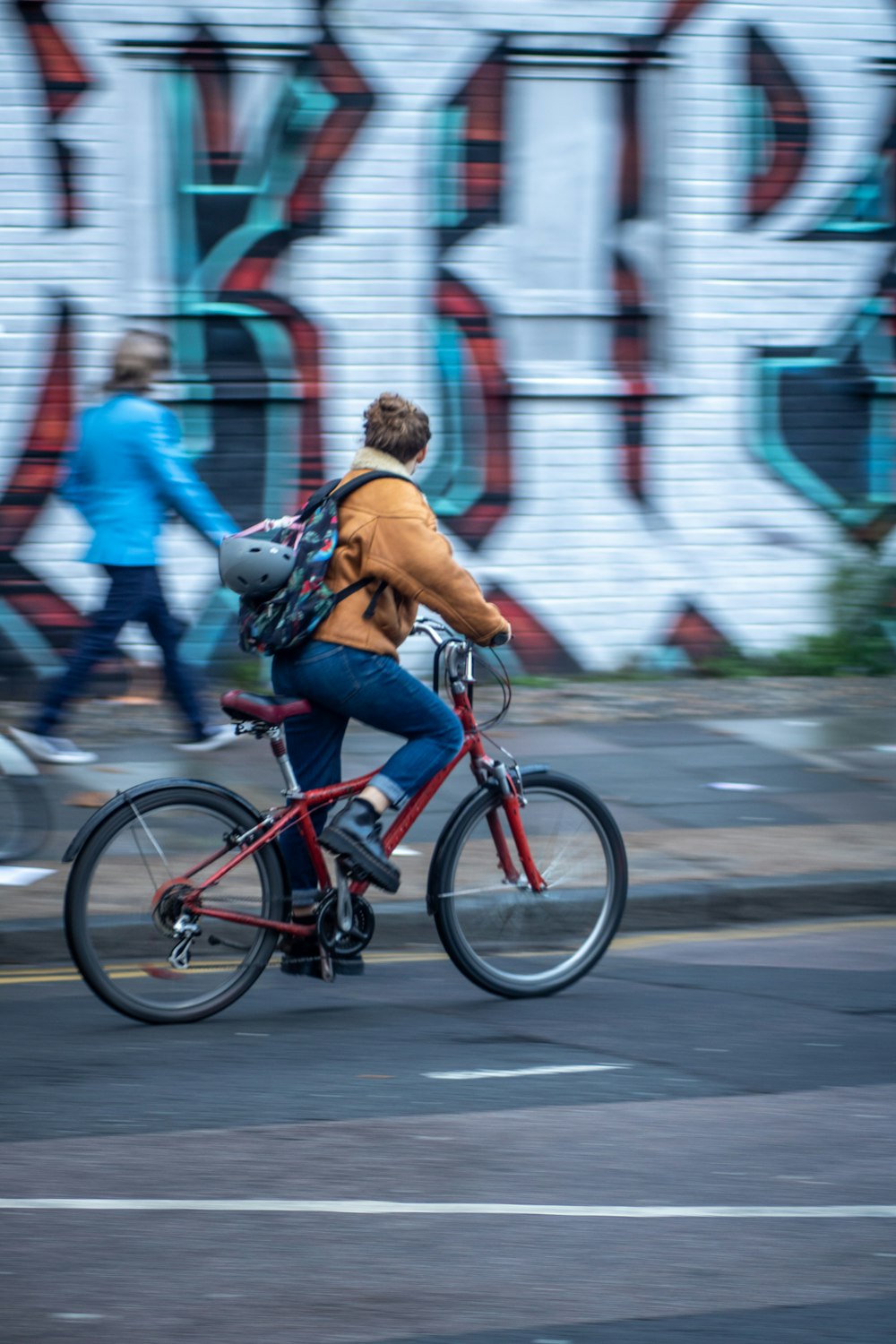 panning photography of person on bike