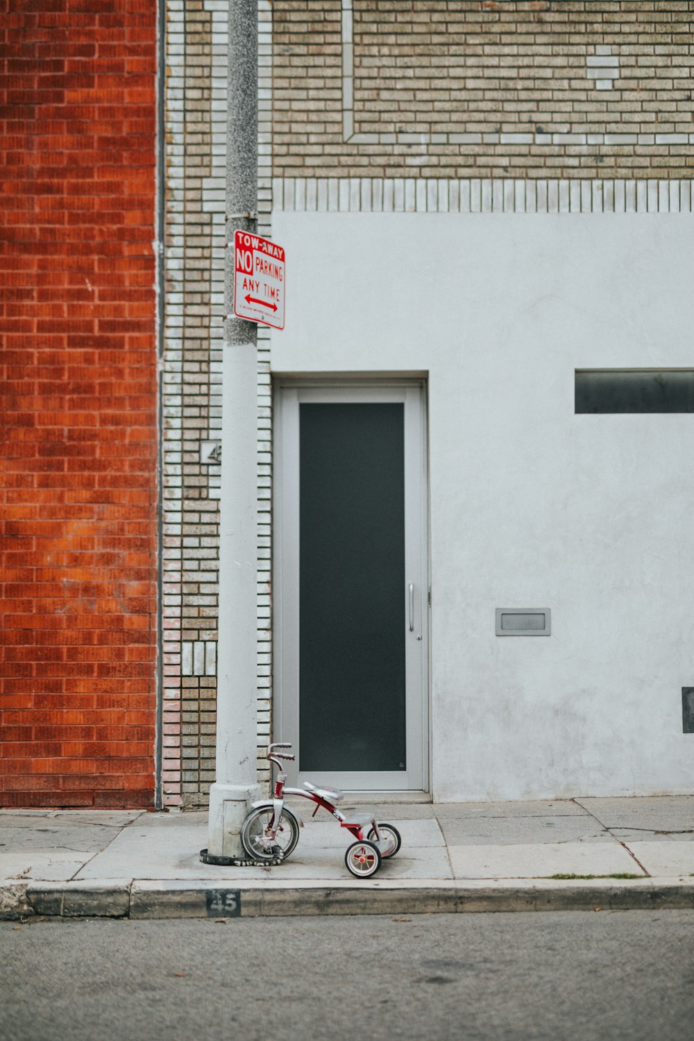 trike parked on sidewalk