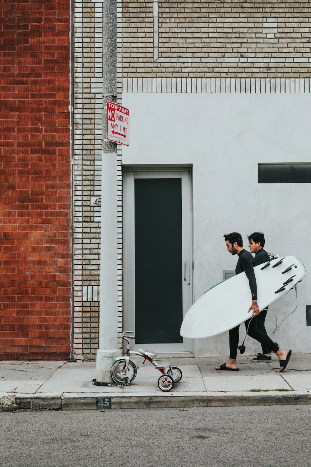 man holding surfboard