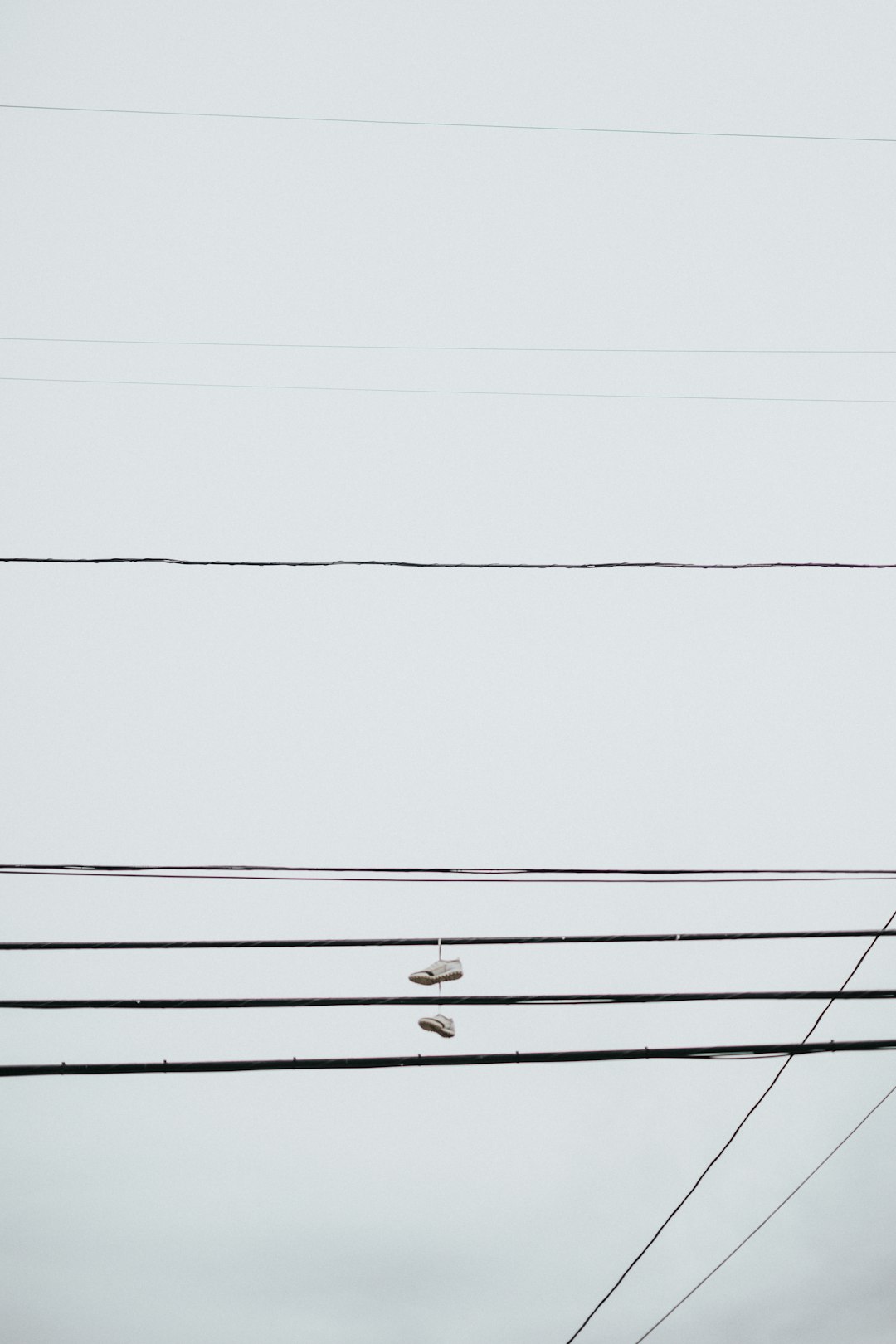 shoes hanging on utility cable