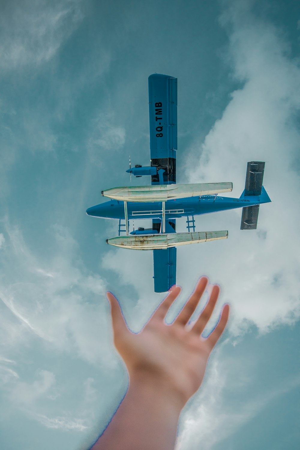 blue monoplane on mid air