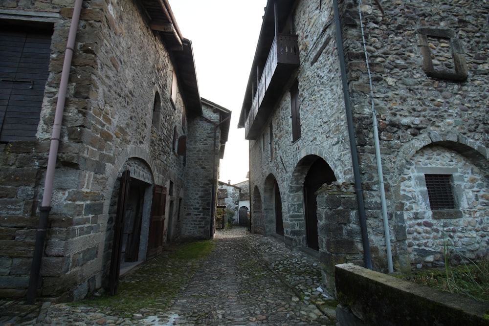 narrow pathway between stone houses