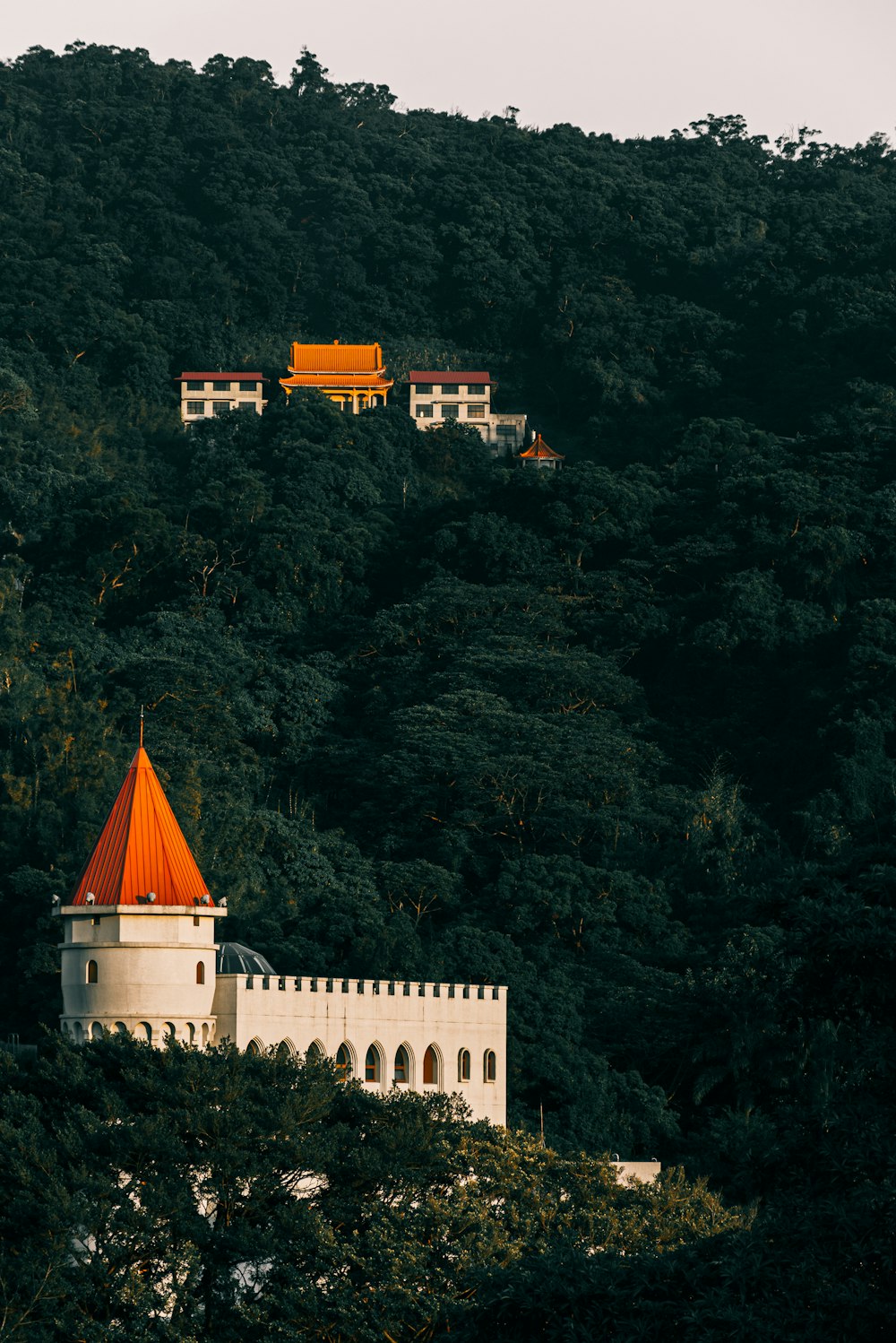 white and orange castle on hills