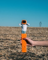 person wearing TV helmet with remote