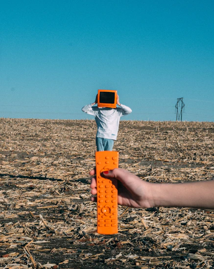 person wearing TV helmet with remote