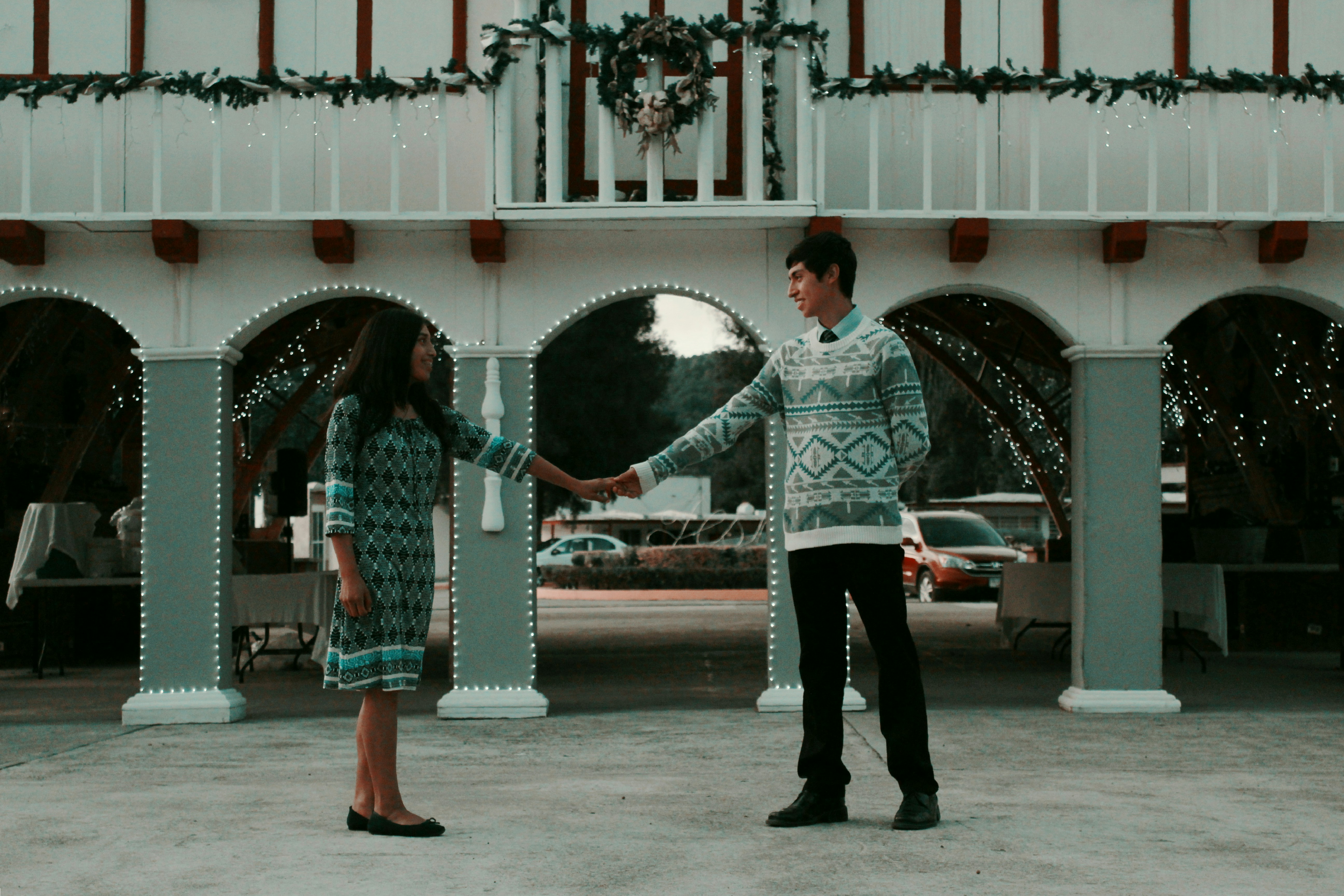 man and woman standing while holding hands on pathway near road, Love Mexican Vol IV