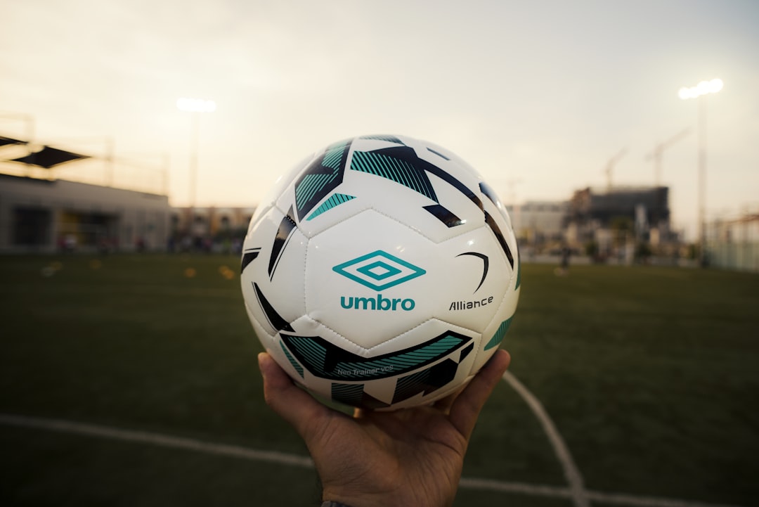 white and green Umbro soccer