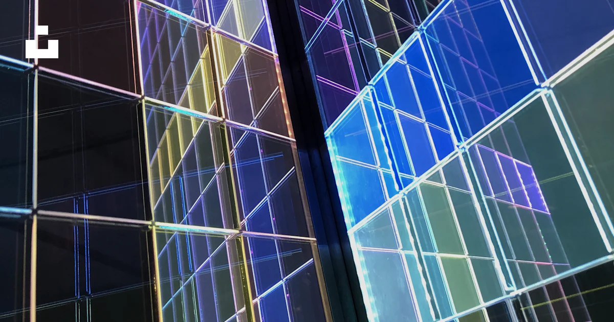 A tall building with many different colored squares on it photo – Free ...