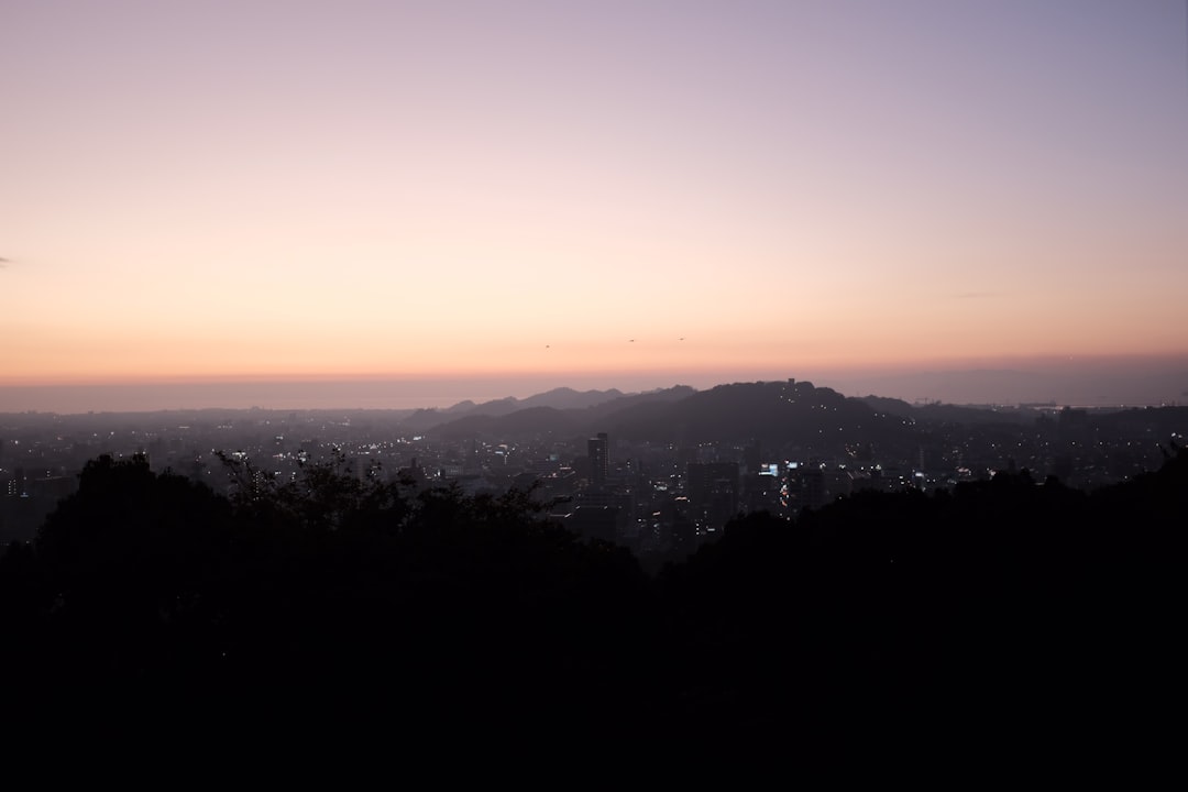silhouette of mountain and city view