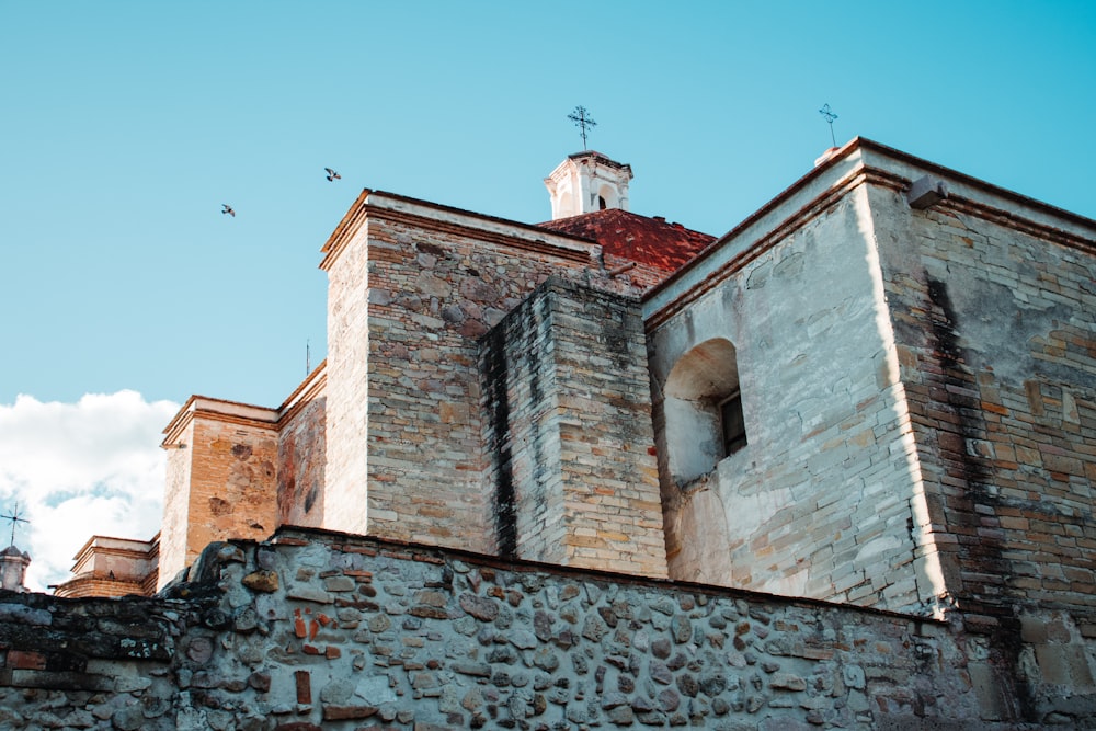 a stone building with a clock tower on top of it