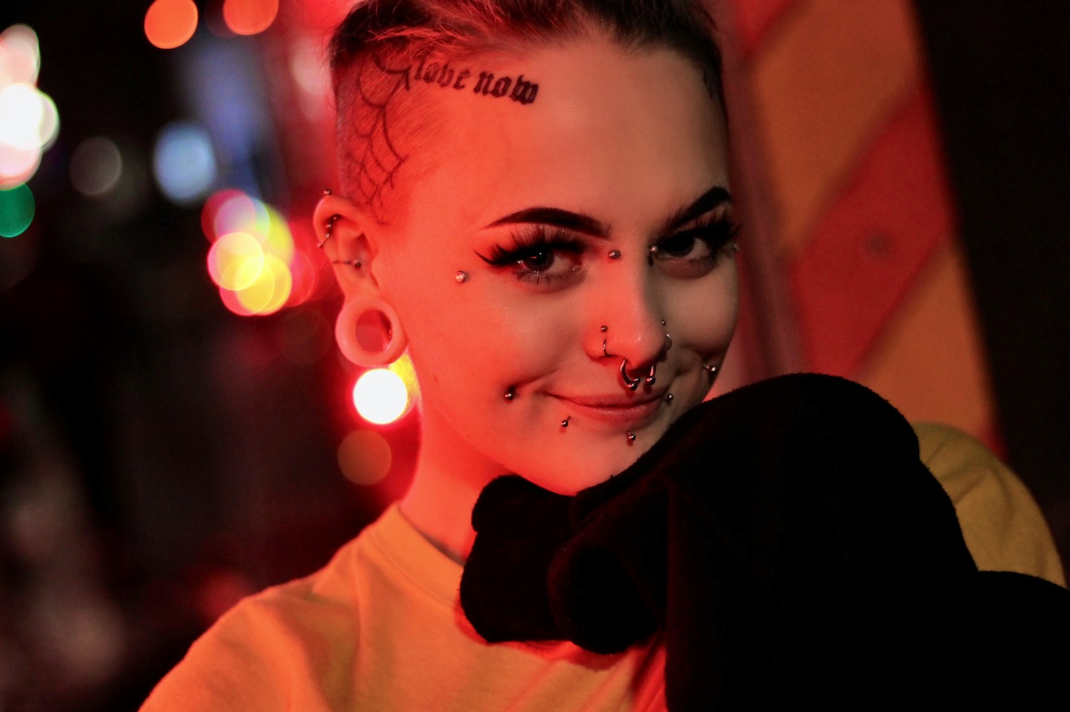 Woman with a delicate nose stud looking to the side