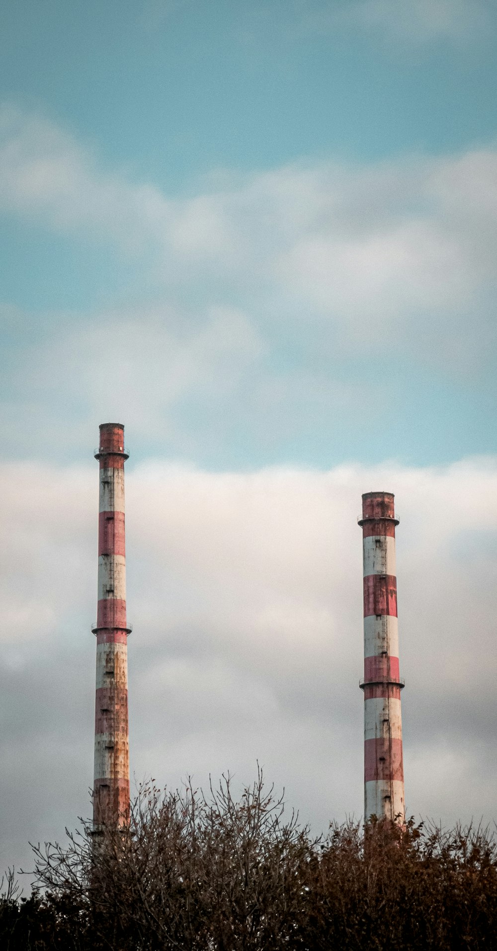 photo of two white and red towers