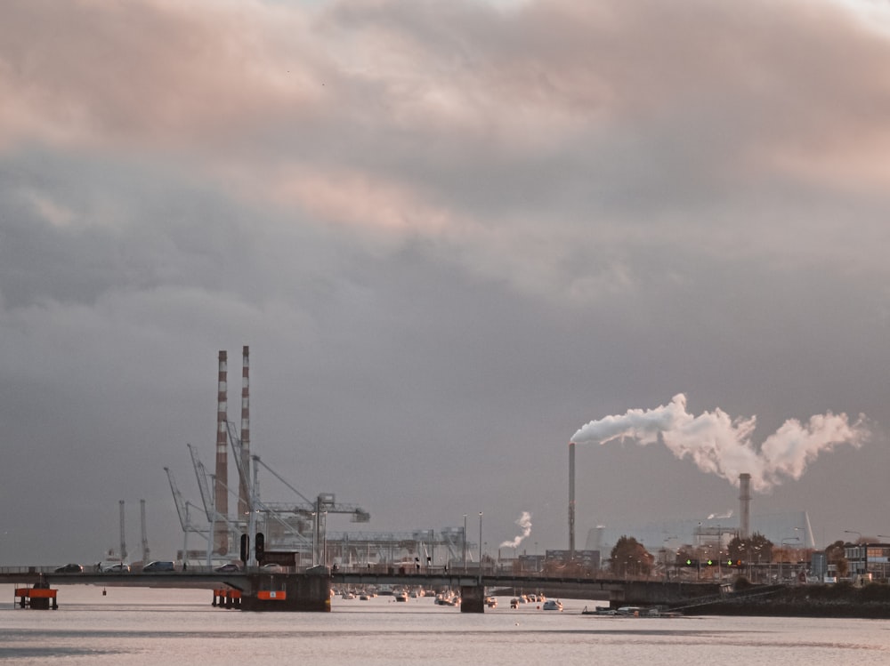 buildings near body of water under white and gray sky