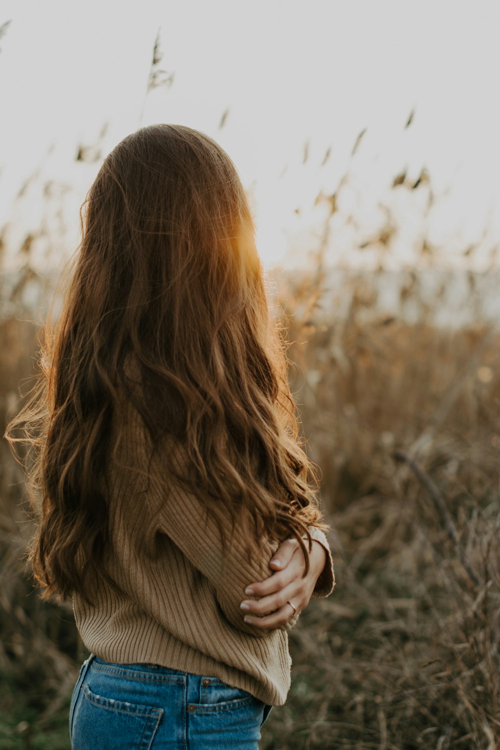 woman standing on plant field during day