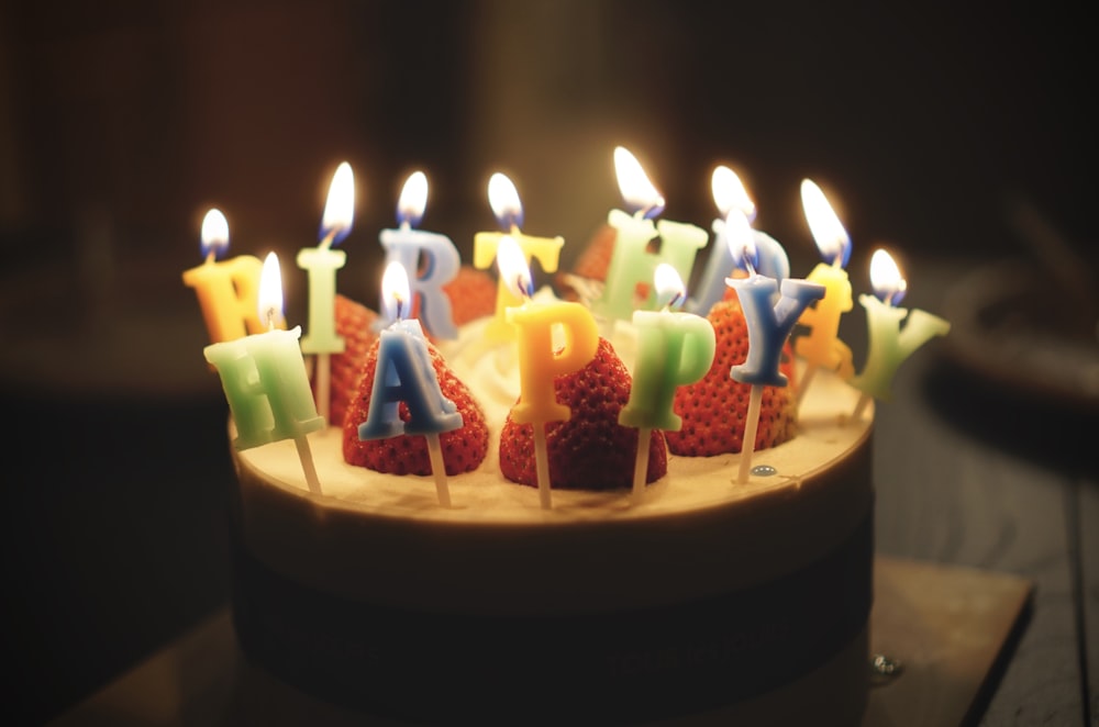 baked cake with happy birthday candles on top