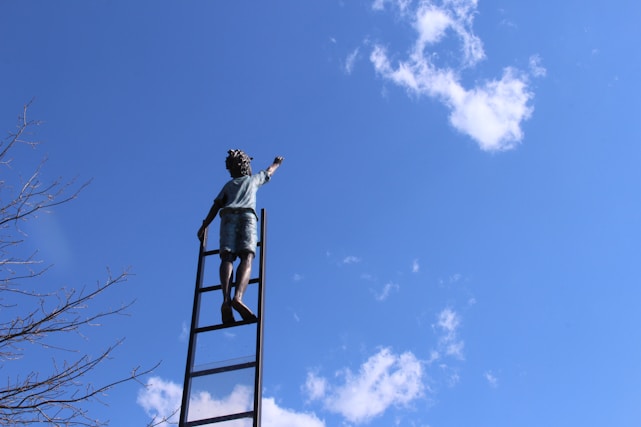 An inspiring image of a person reaching for the sky, symbolizing personal growth.