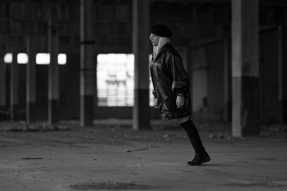 standing woman leaning forward inside building