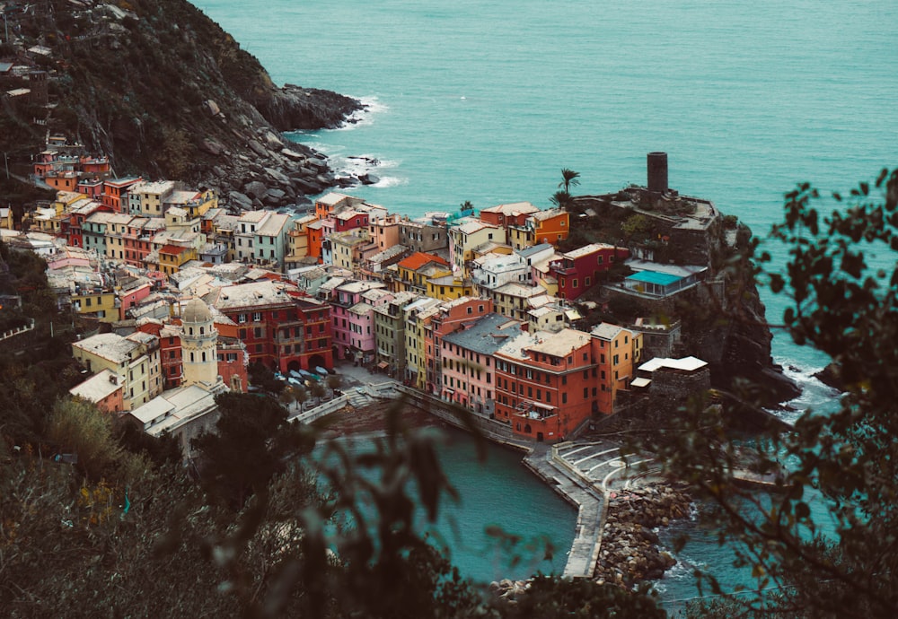 aerial photography of buildings beside body of water