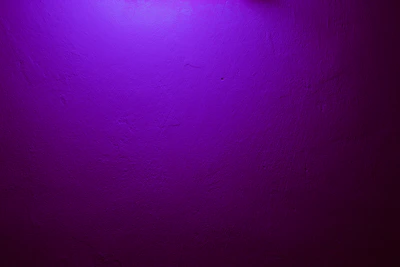 a purple wall with a clock on it