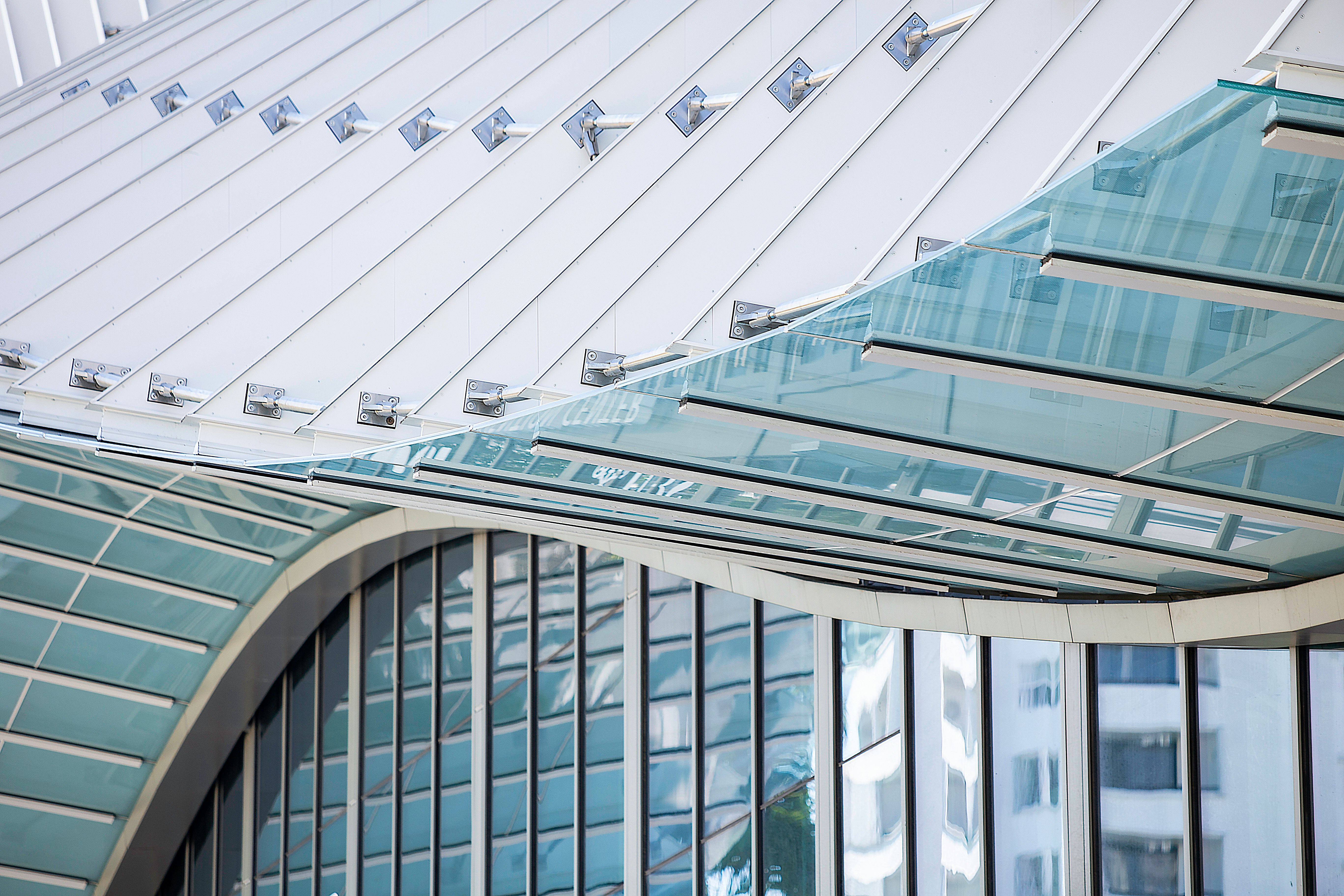 glass and white building during daytime