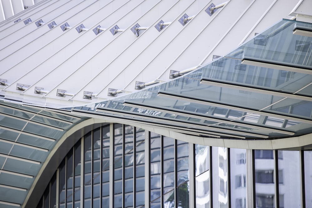 glass and white building during daytime