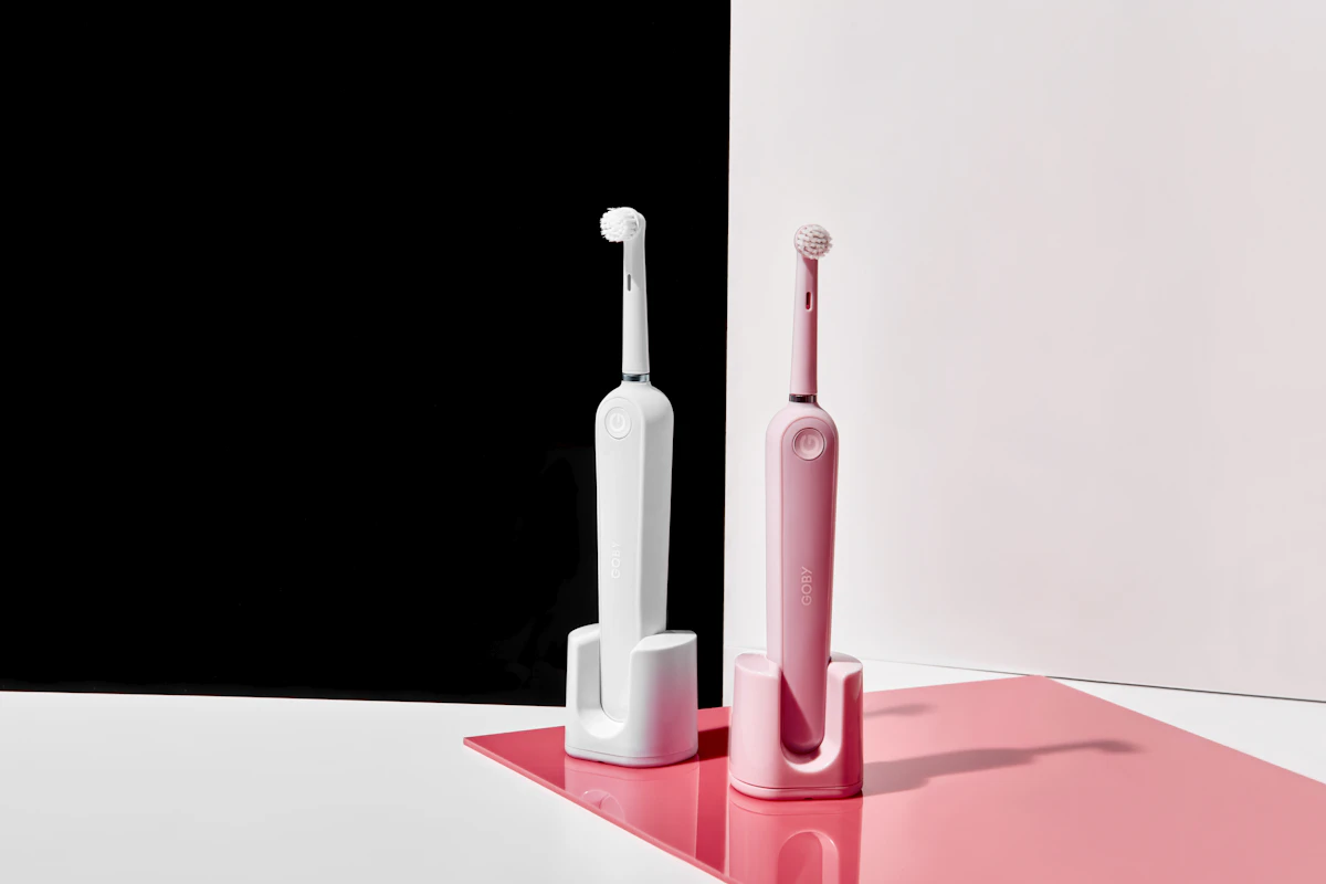 Electric sonic toothbrush and water flosser on bathroom counter