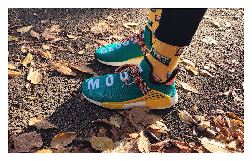 pair of green-and-yellow running shoes