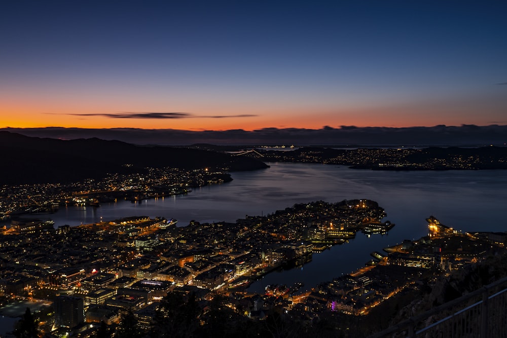 a view of a city at night from a hill