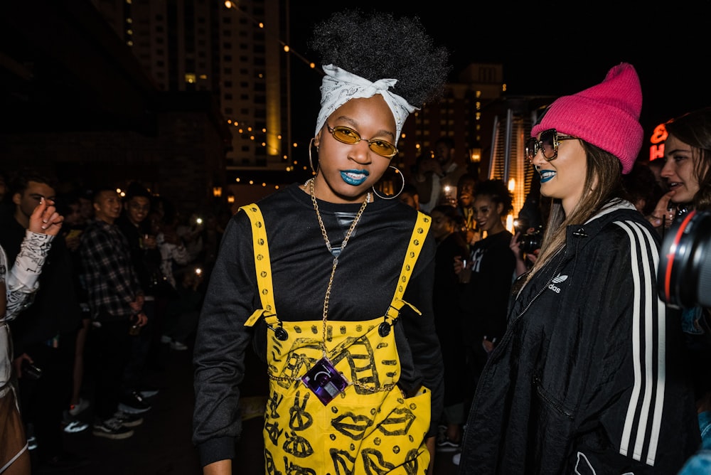 a couple of women standing next to each other