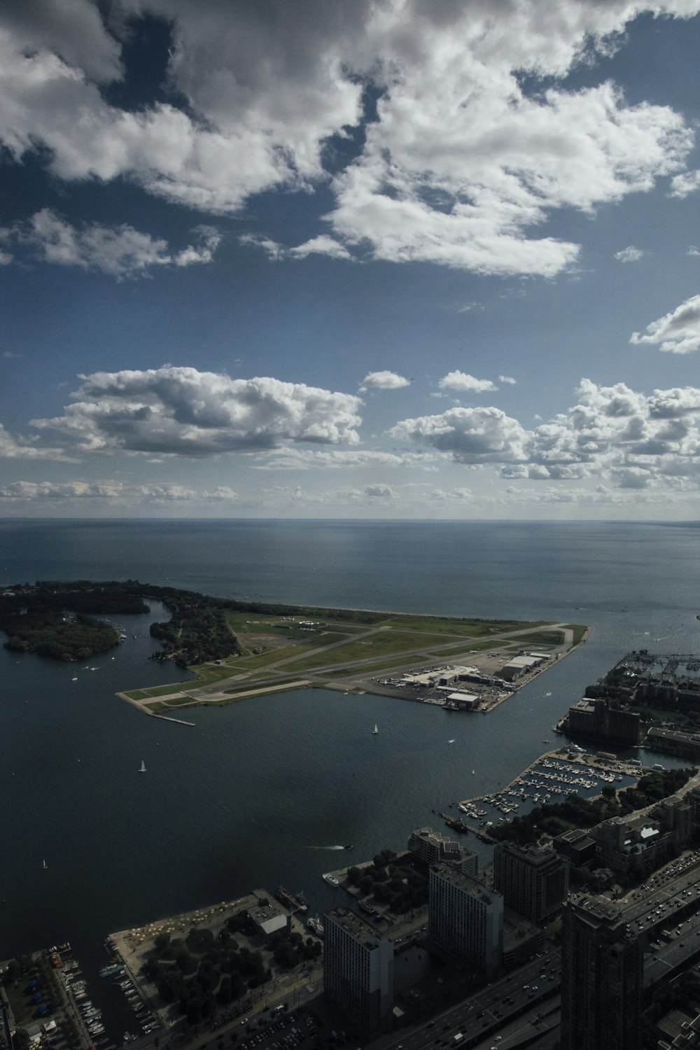 an aerial view of a city and a body of water