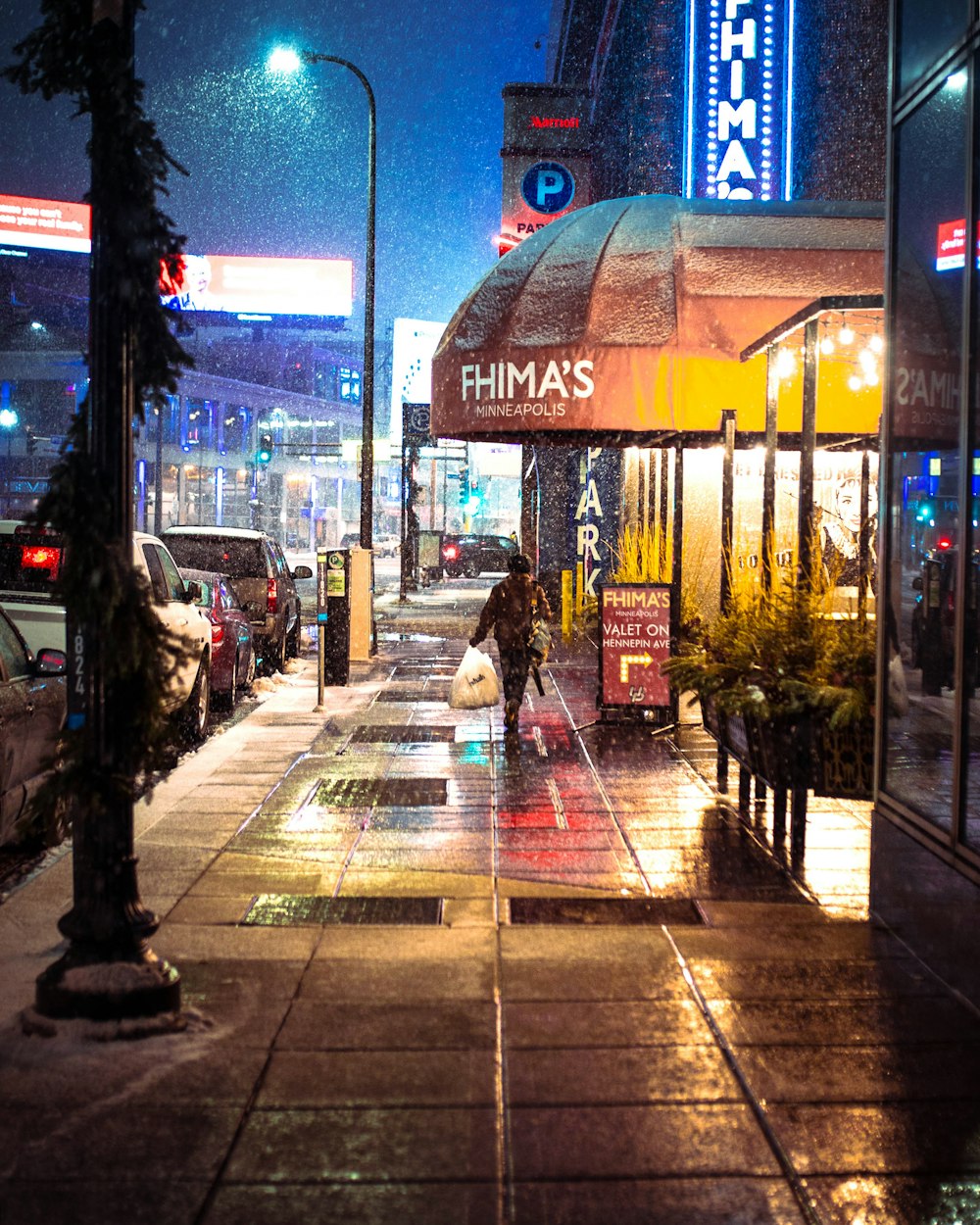 woman walking on street duting night time