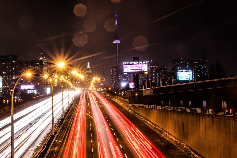 a city street filled with lots of traffic at night