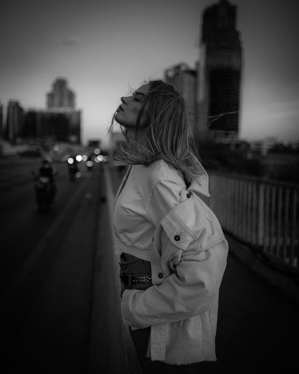 woman standing on sidewalk