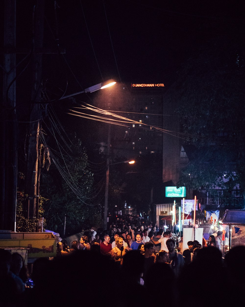 people on road at night