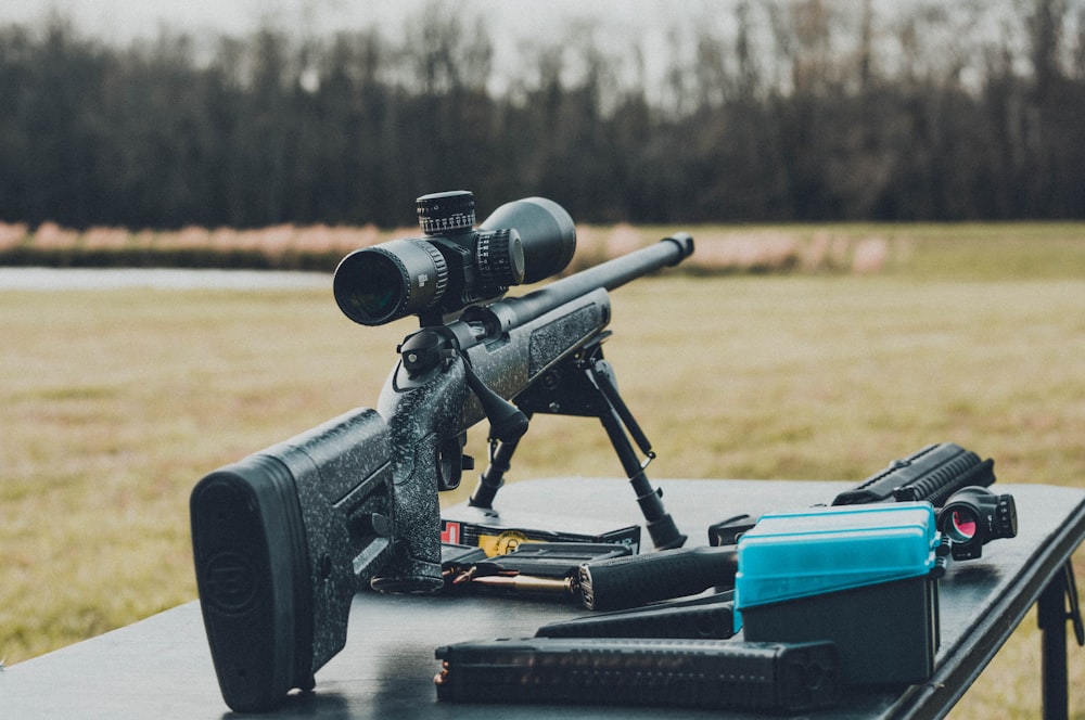 black rifle on table