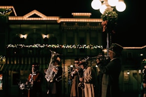 The brass section of Swing Legends in sync, their instruments gleaming under the spotlight.