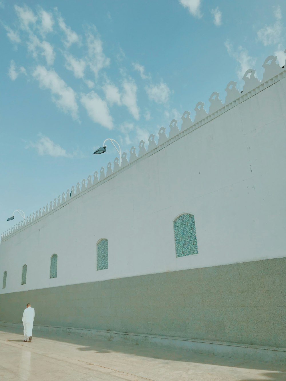 person walking near wall