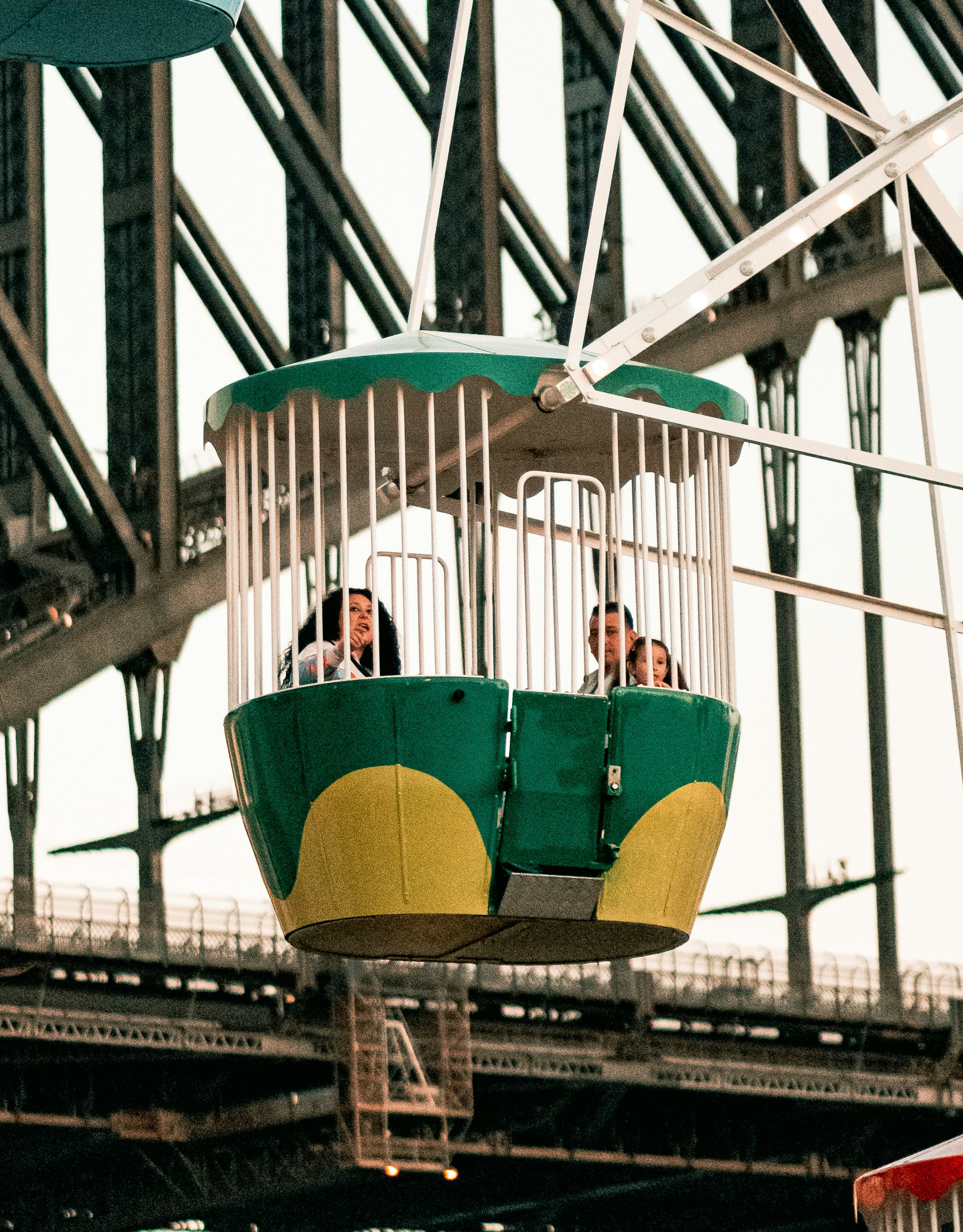 three person riding Ferris wheel