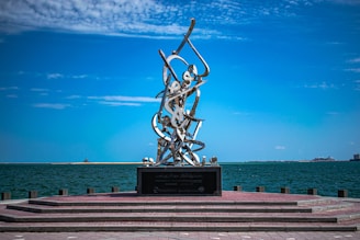 photography of monument beside body of water during daytime