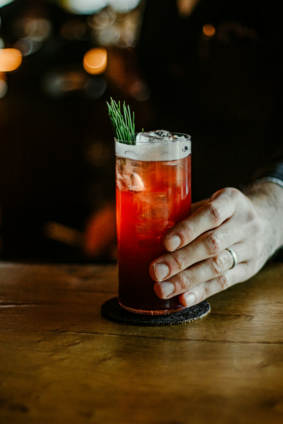 person holding glass cup